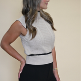 Dèluc Sleeveless Turtleneck Sweater Vest featuring detailed stitching above the waist, around the neckline, and diagonally from collar to armhole for a refined finish.