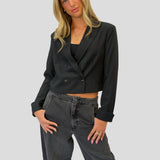 Modern black double-breasted blazer by Steve Madden with sharp tailoring and cuffed sleeve detail