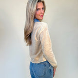 Back of denim collar washed polo women's top from shear boutique. Paired with blue jeans