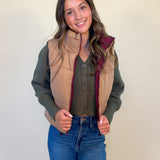 front view of kansas reversible puffer gilet vest. Tan and burgundy, wearing tan on the outside. Women's reversible puffer vest. Shear boutique fall collection