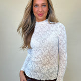 front view of textured knit top - white sheer long sleeve mock/ turtle neck lace top. Shear Boutique