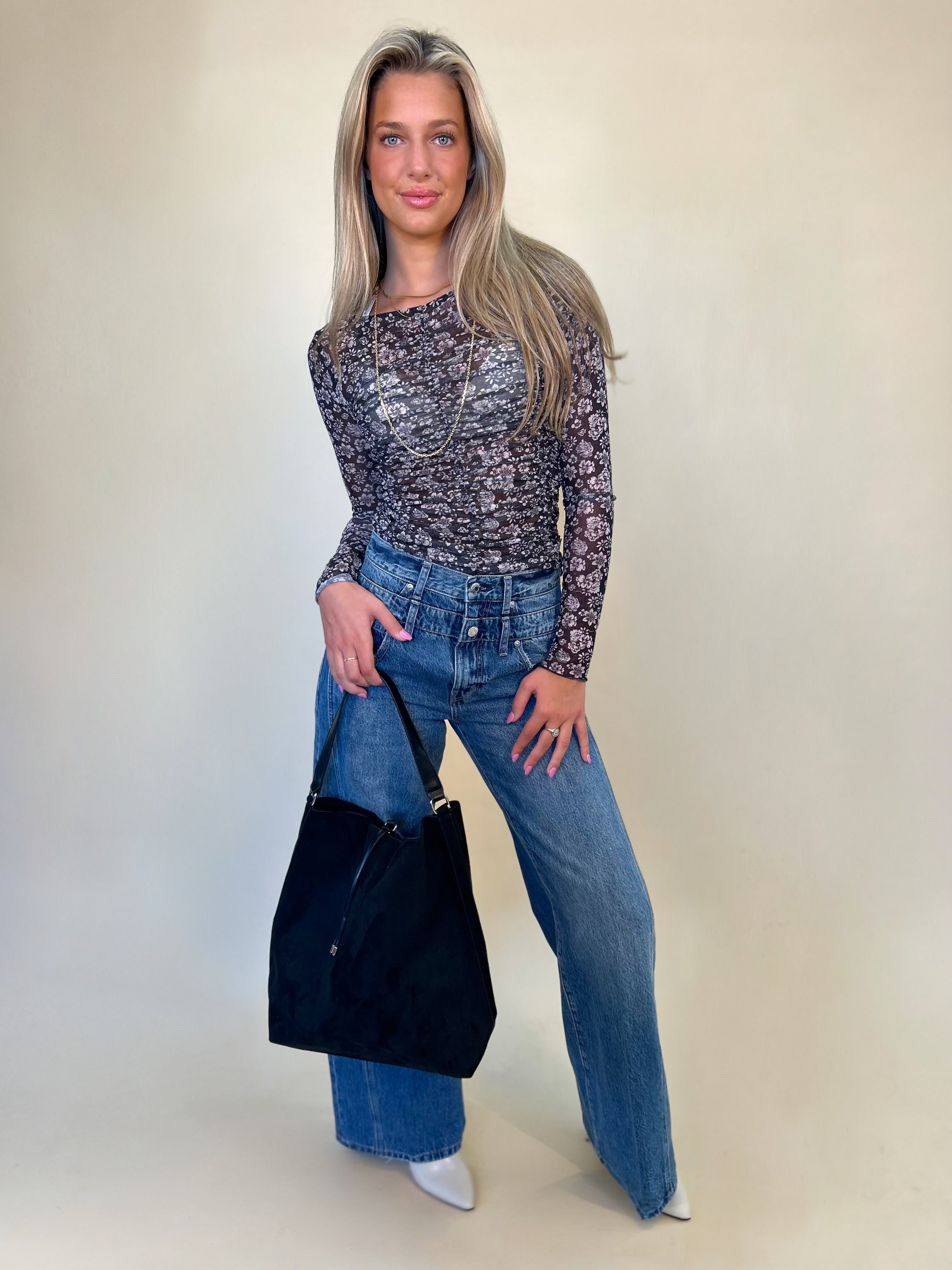 full view of mesh print top styled with caleb double waistband jeans and black hobo bag. womens clothing Shear Boutique