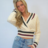 Chic Steve Madden Addison Cropped Sweater featuring sporty striped accents and a cozy knit design that adds a modern twist to a timeless silhouette.