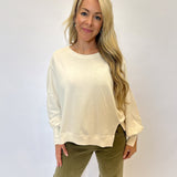 Chic and comfortable Dear John Trenton Long Sleeve Shirt — white knit with puff sleeves, wide cuffs, and a flattering longline silhouette.