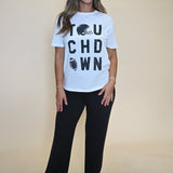 Comfy oversized white T-shirt by Z Supply with black “Touchdown” text across the front, styled in a casual boyfriend cut.