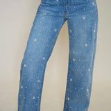 Close-up detail of Steve Madden Fianna Embellished Barrel Jeans with pearl and rhinestone embellishments on light wash denim