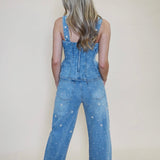Back view of model in Steve Madden Fiorella Embellished Denim Top and Fianna Embellished Barrel Jeans, showing fit and detailing