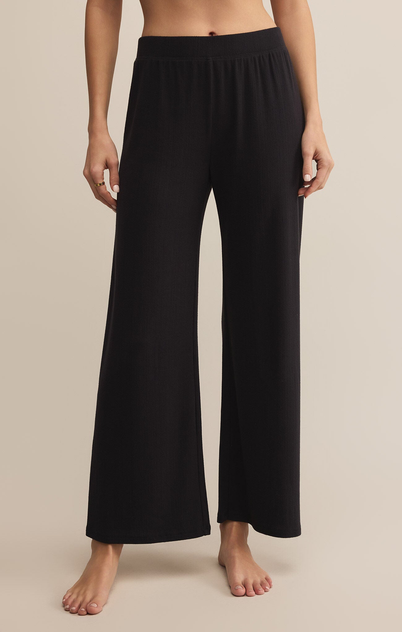 Z Supply Luxe Starry Eyed Pants in black, featuring wide legs and a chic, lounge-ready style with a luxurious feel.