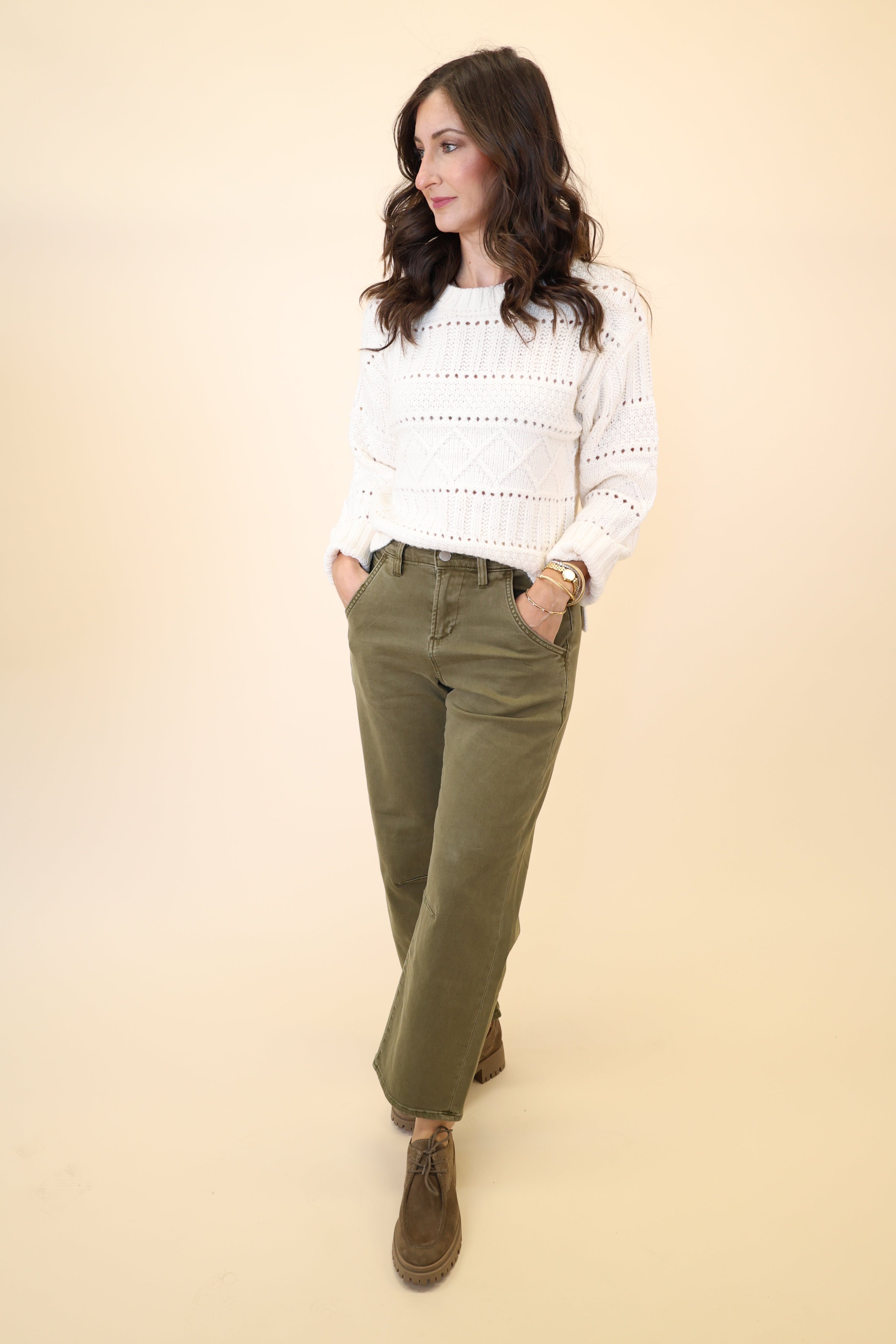 Green barrel leg denim cargos by Dear John styled with the Cento Cable Knit Sweater — casual and chic