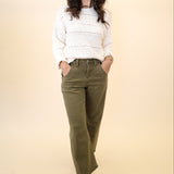 Dear John Lasso barrel leg cargo pants paired with the Cento Cable Knit Sweater for a cozy fall outfit