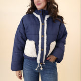 Miou Muse navy quilted jacket with white sherpa front pockets and adjustable drawstring hem