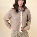 Soft beige Miou Muse cardigan with feminine frilled edges and lace-trimmed front