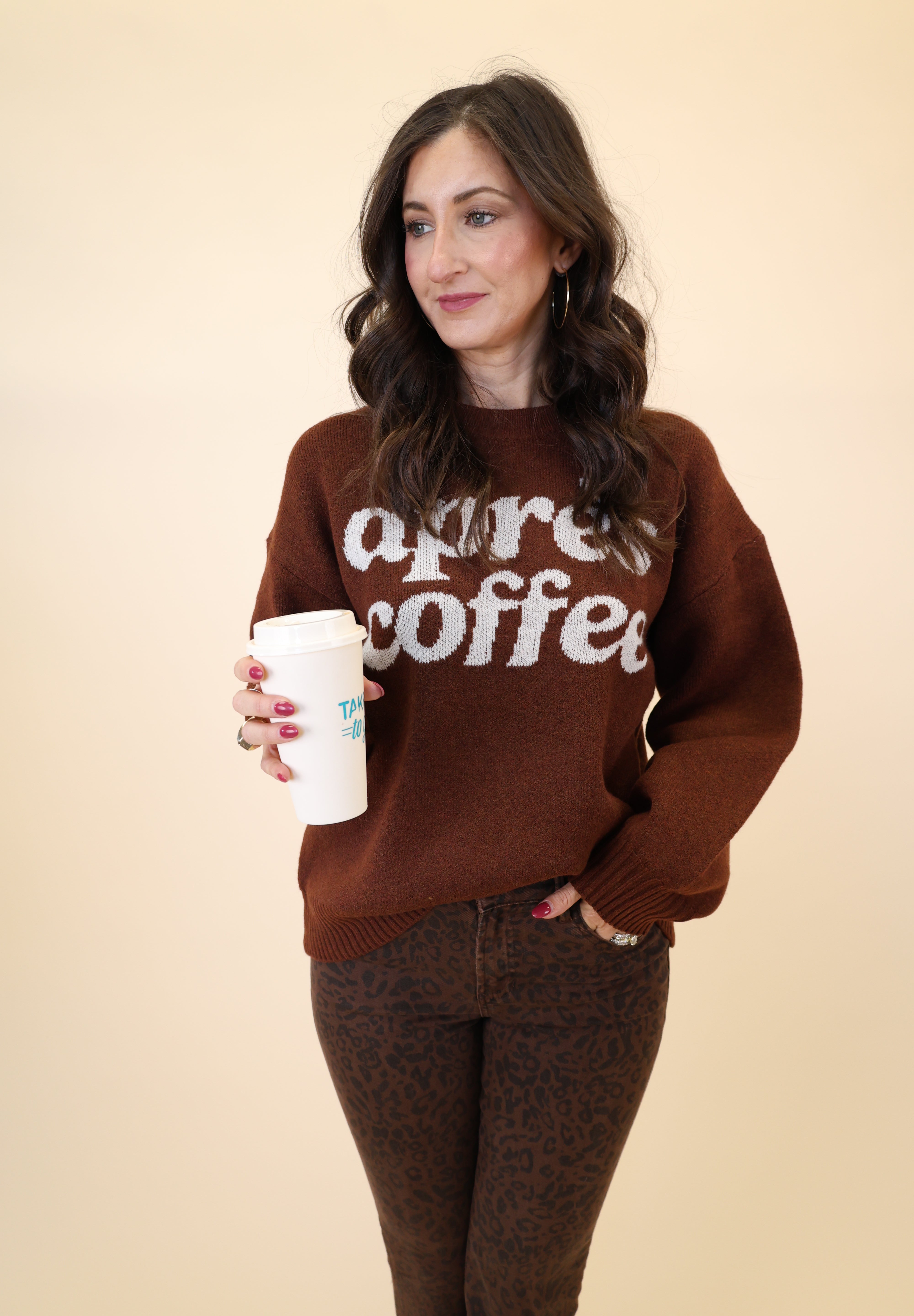 Girl Dangerous brown crewneck sweatshirt with bold white lettering and relaxed fit