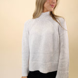 White knit funnel neck sweater from Z Supply offering a chic, modern silhouette