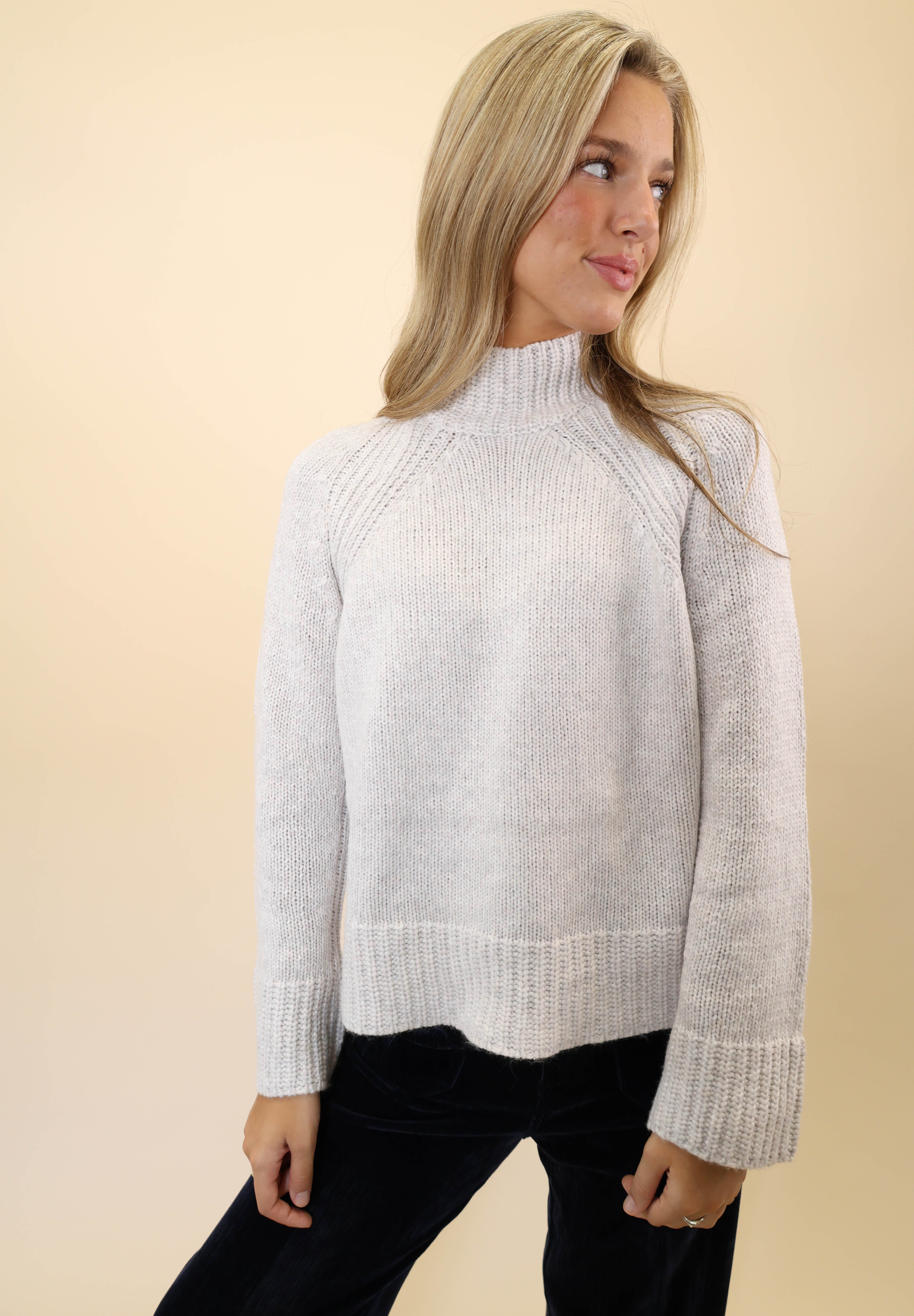 White knit funnel neck sweater from Z Supply offering a chic, modern silhouette