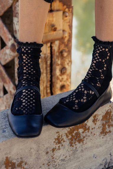 Black Free People Rubies crochet crew socks featuring soft cotton fabric and ruffled trim