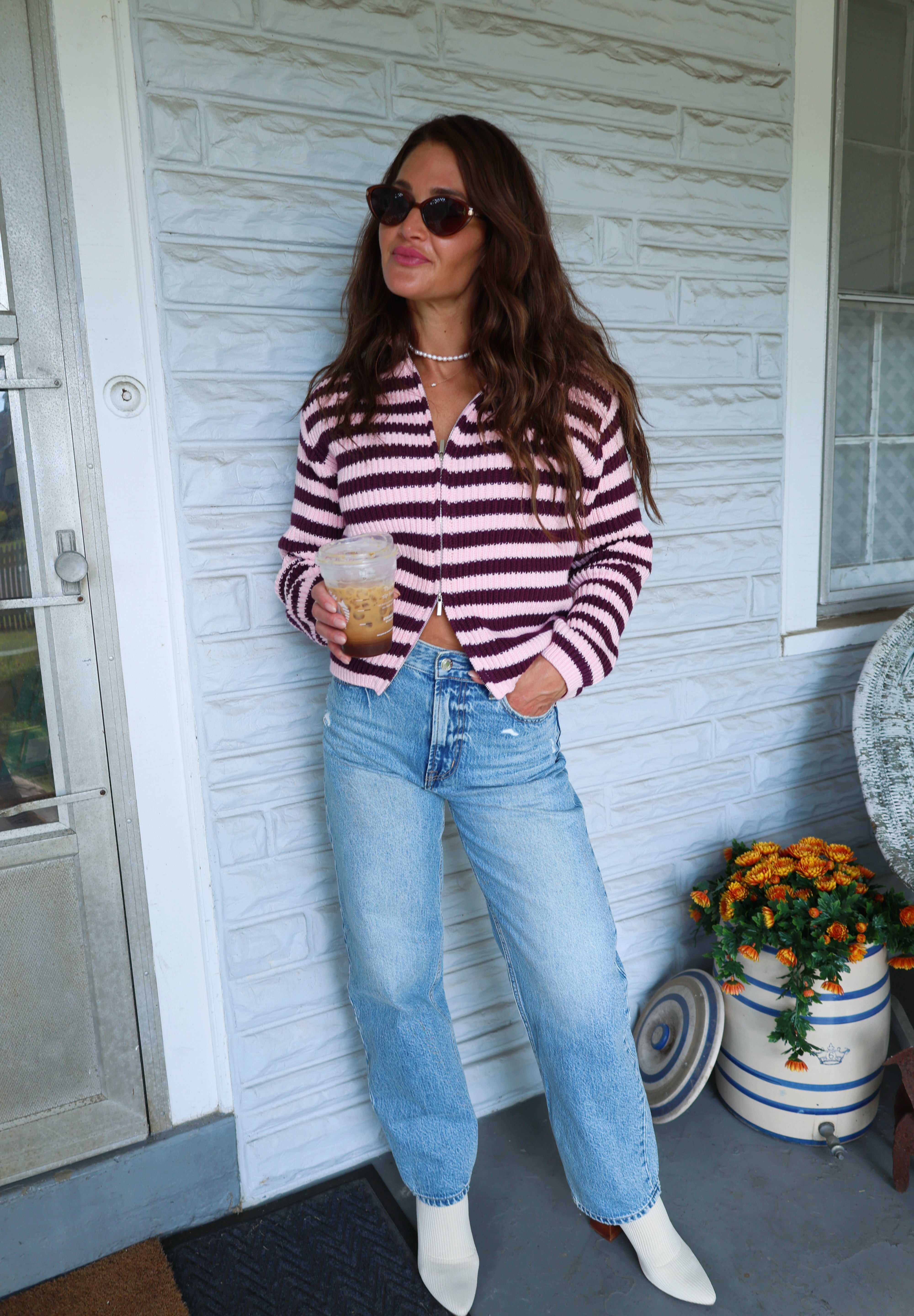 Cozy striped zip-up sweater for women styled with denim for fall