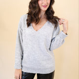 Deluc Catalpa Sweater in soft grey with shimmering fabric and classic v-neck design.