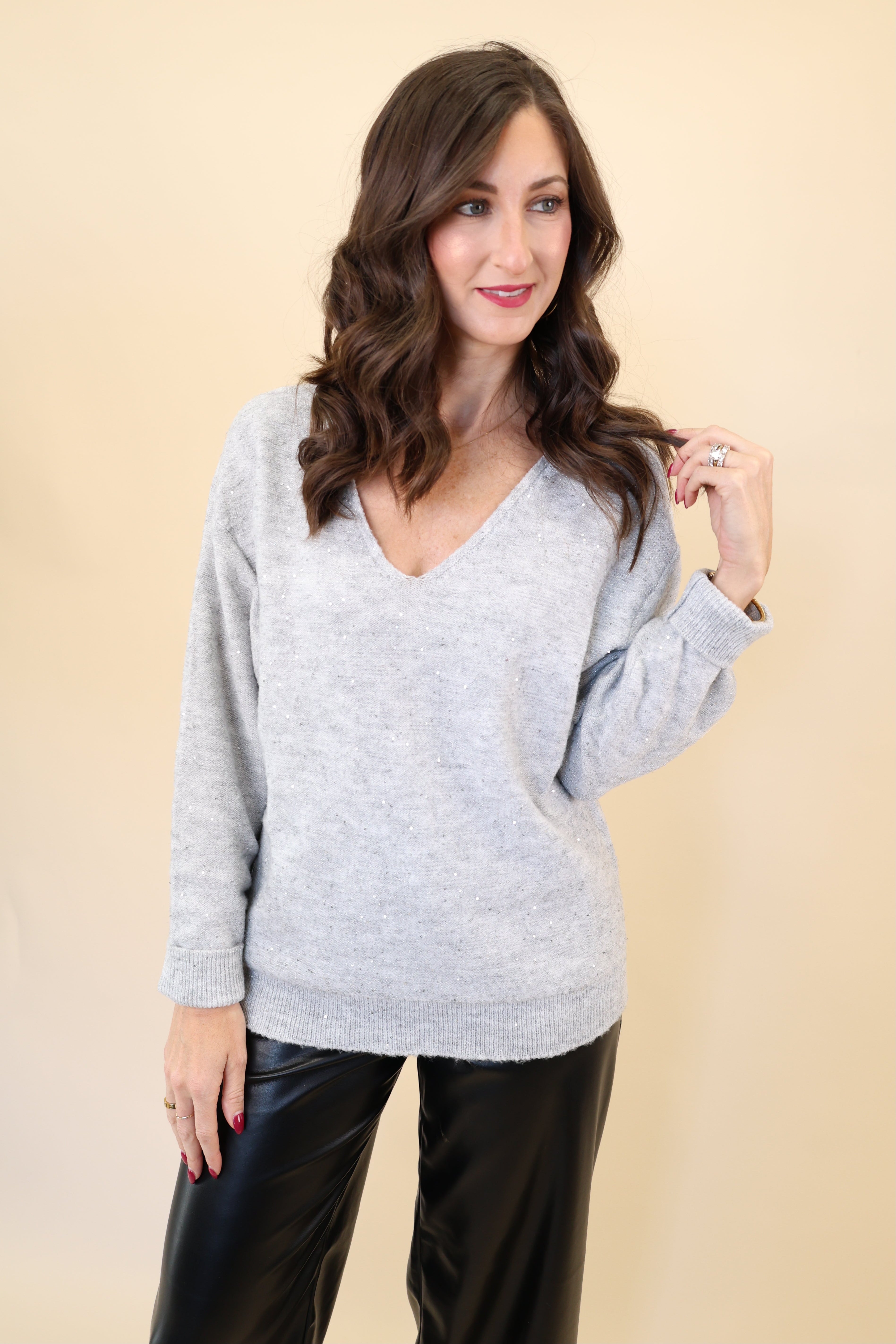 Deluc Catalpa Sweater in soft grey with shimmering fabric and classic v-neck design.
