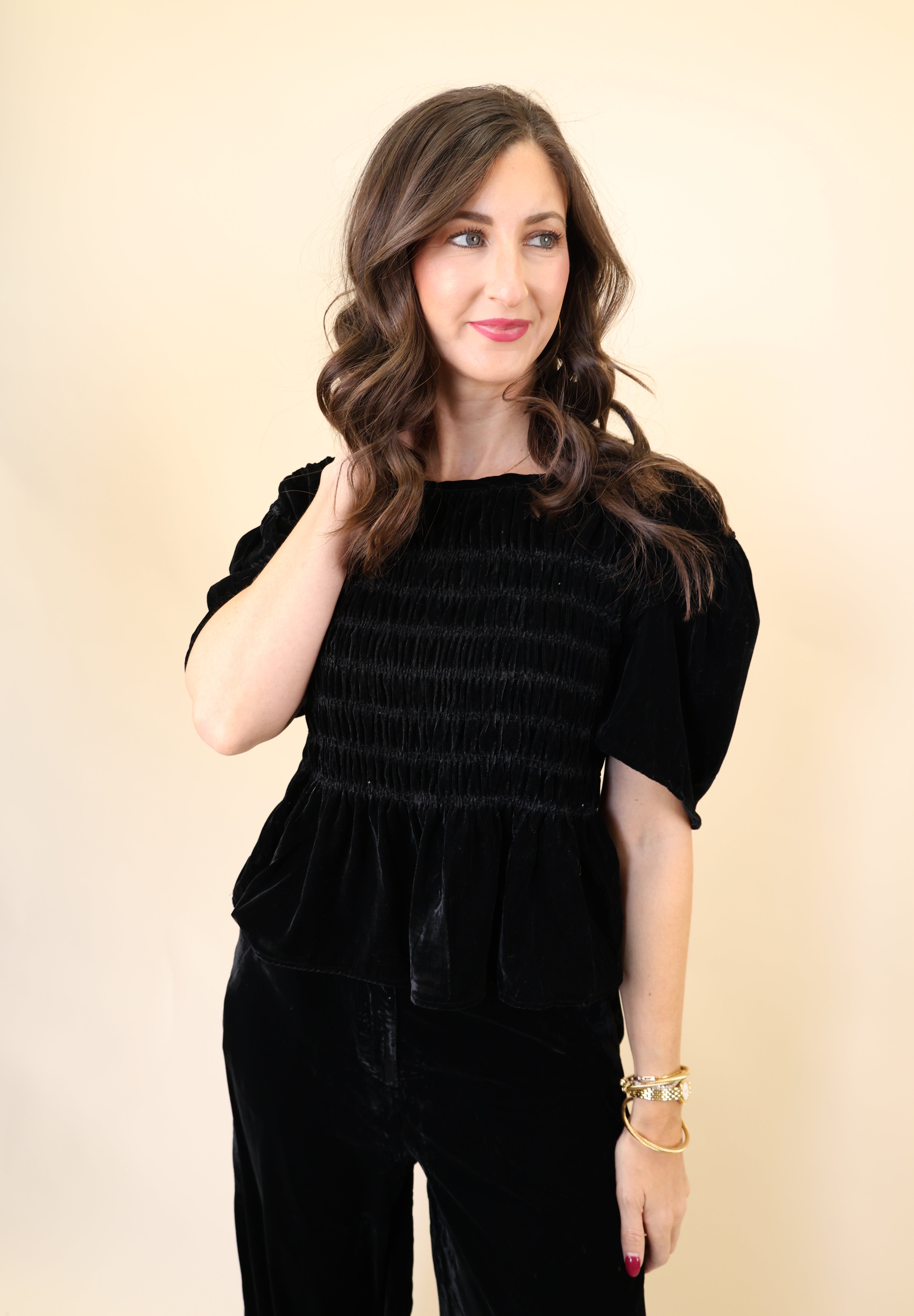 Black velvet top by Deluc featuring relaxed fit and wide short sleeves.