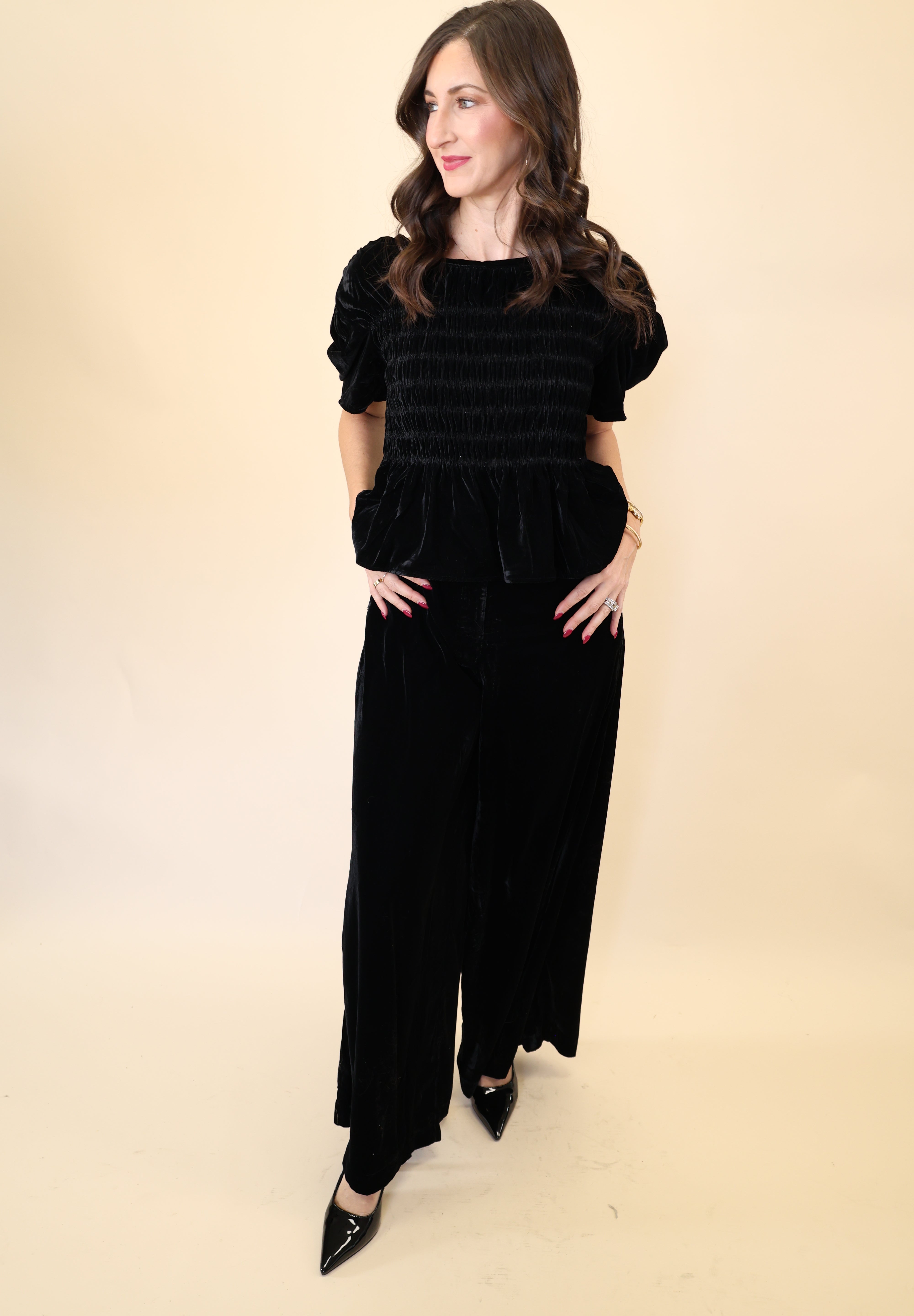 Front view of Deluc Daisy Pants showcasing plush black velvet fabric and flowy wide leg design.