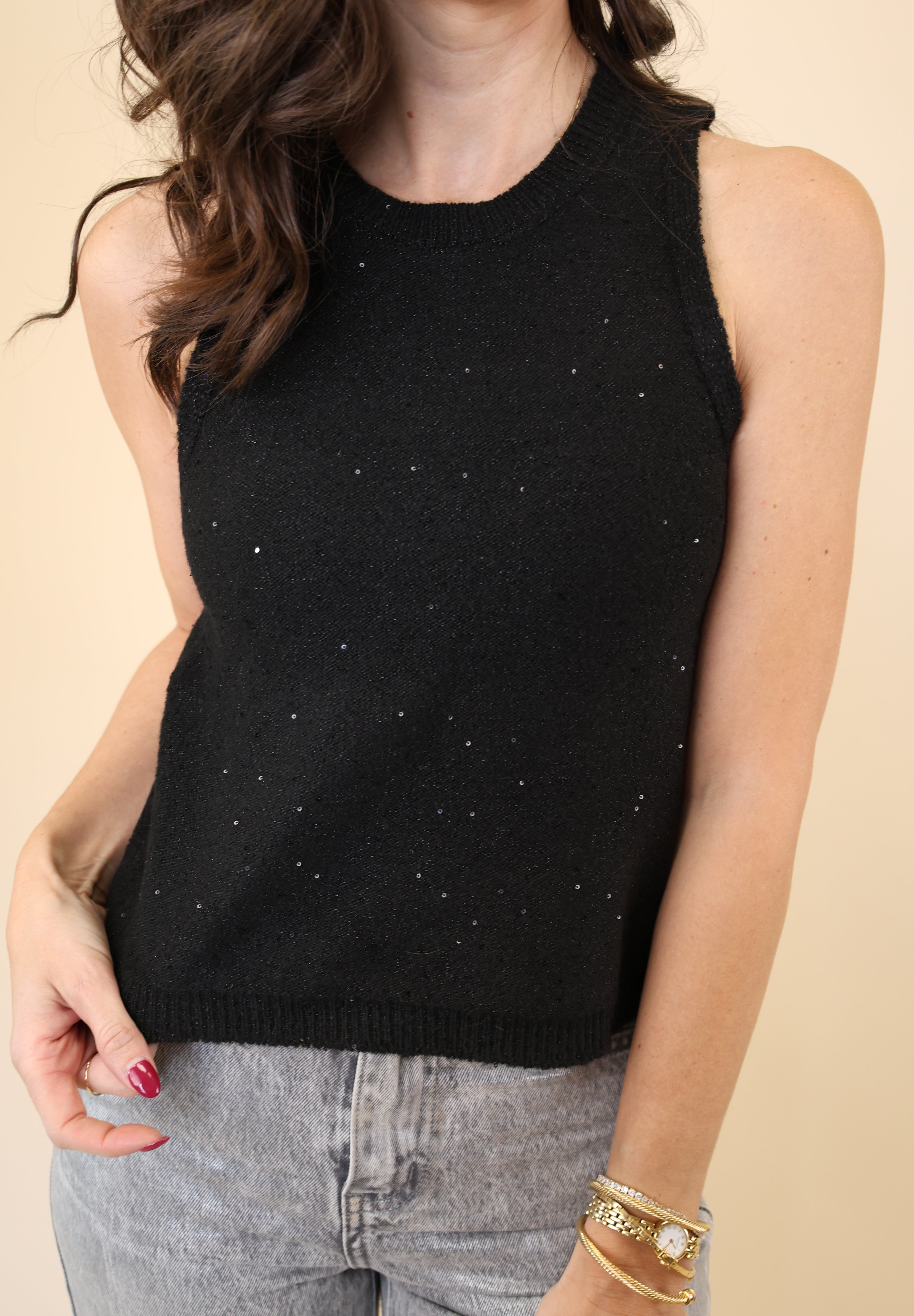 Black sleeveless knit top from Deluc featuring subtle sparkles and a fitted, polished look.