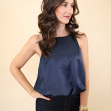 Deluc Leonard satin tank in deep navy with cropped hemline and soft, flowy drape.