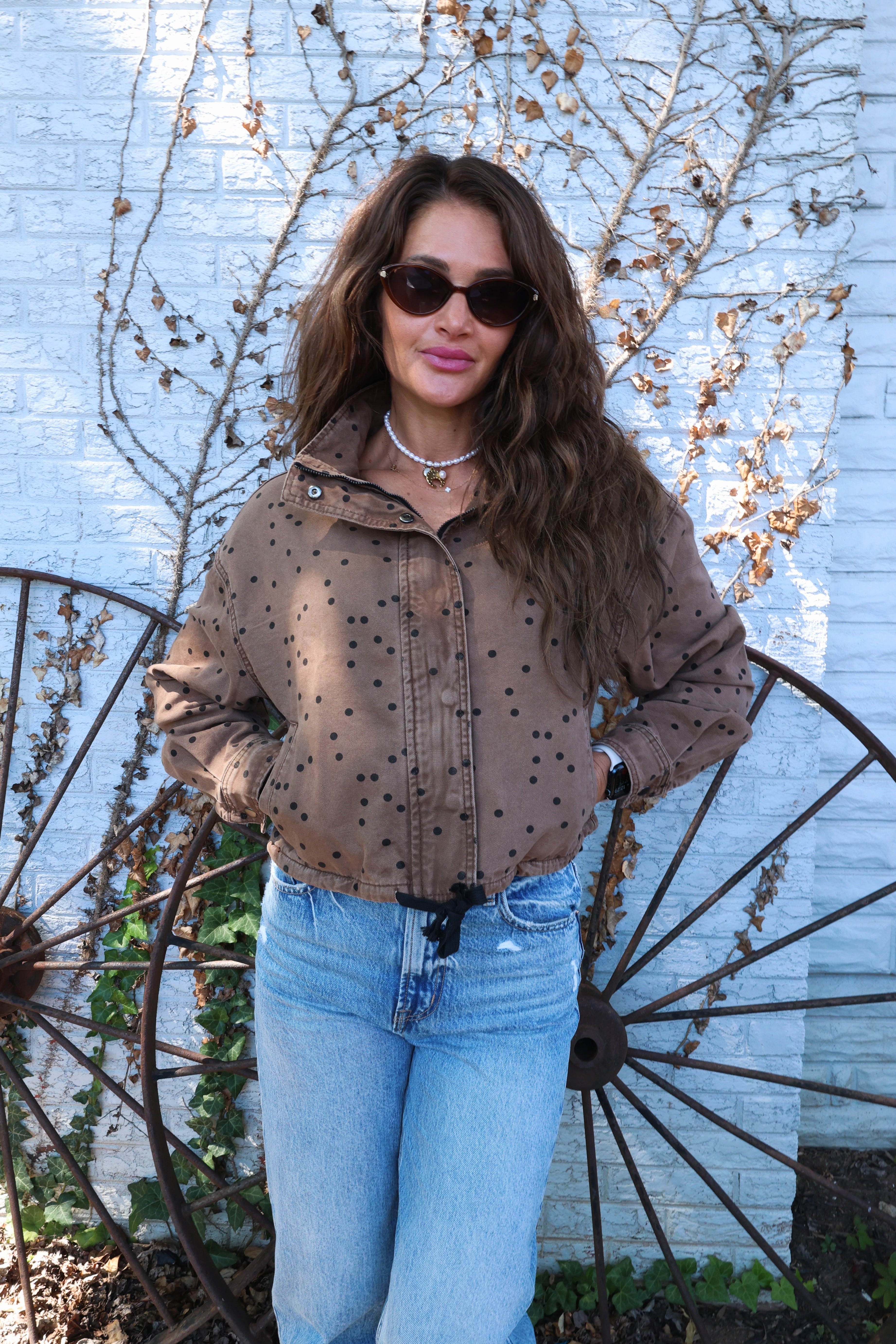 The Spotted Funnel Jacket in espresso brown with braided trim and cropped fit