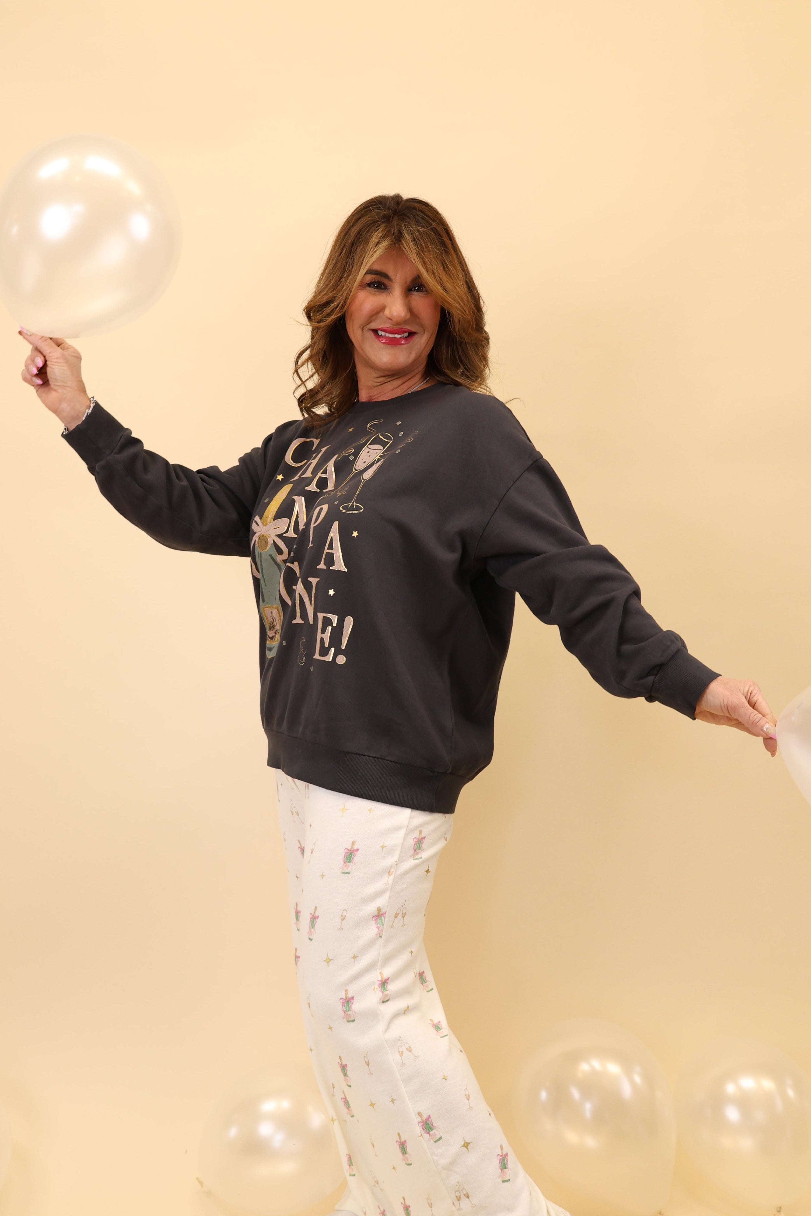 Z Supply Celebrate Sunday sweatshirt with a “champagne” graphic, soft brushed fleece, crewneck, and long sleeves.