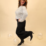 Z Supply Tinseltown Sweater featuring a lightweight sparkly knit with a crew neck, long sleeves, and a cozy pullover design.