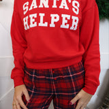 Z Supply long sleeve holiday sweatshirt in bright red with white Santa’s Helper graphic.