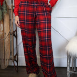 Model wearing Z Supply Hangout Plaid Pant in red flannel, high-rise fit with straight leg silhouette.