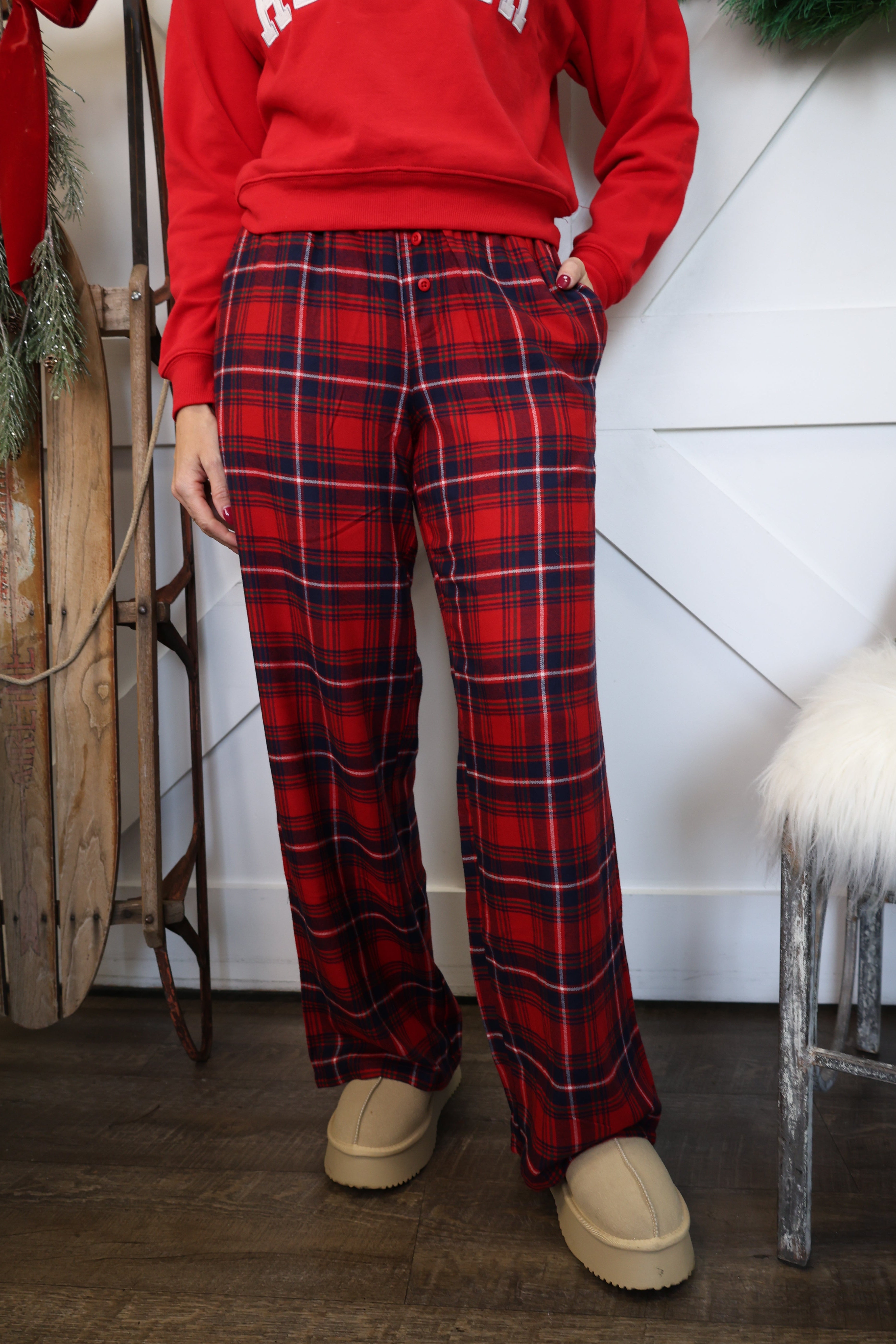 Model wearing Z Supply Hangout Plaid Pant in red flannel, high-rise fit with straight leg silhouette.