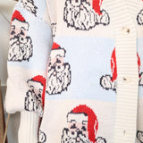 Close-up of Peach Love Santa Checker Oversized Cardigan showing Santa motif, soft knit texture, and button details.