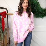 Front view of Peach Love Joy Sweater, pink and white knit with cheerful JOY design.