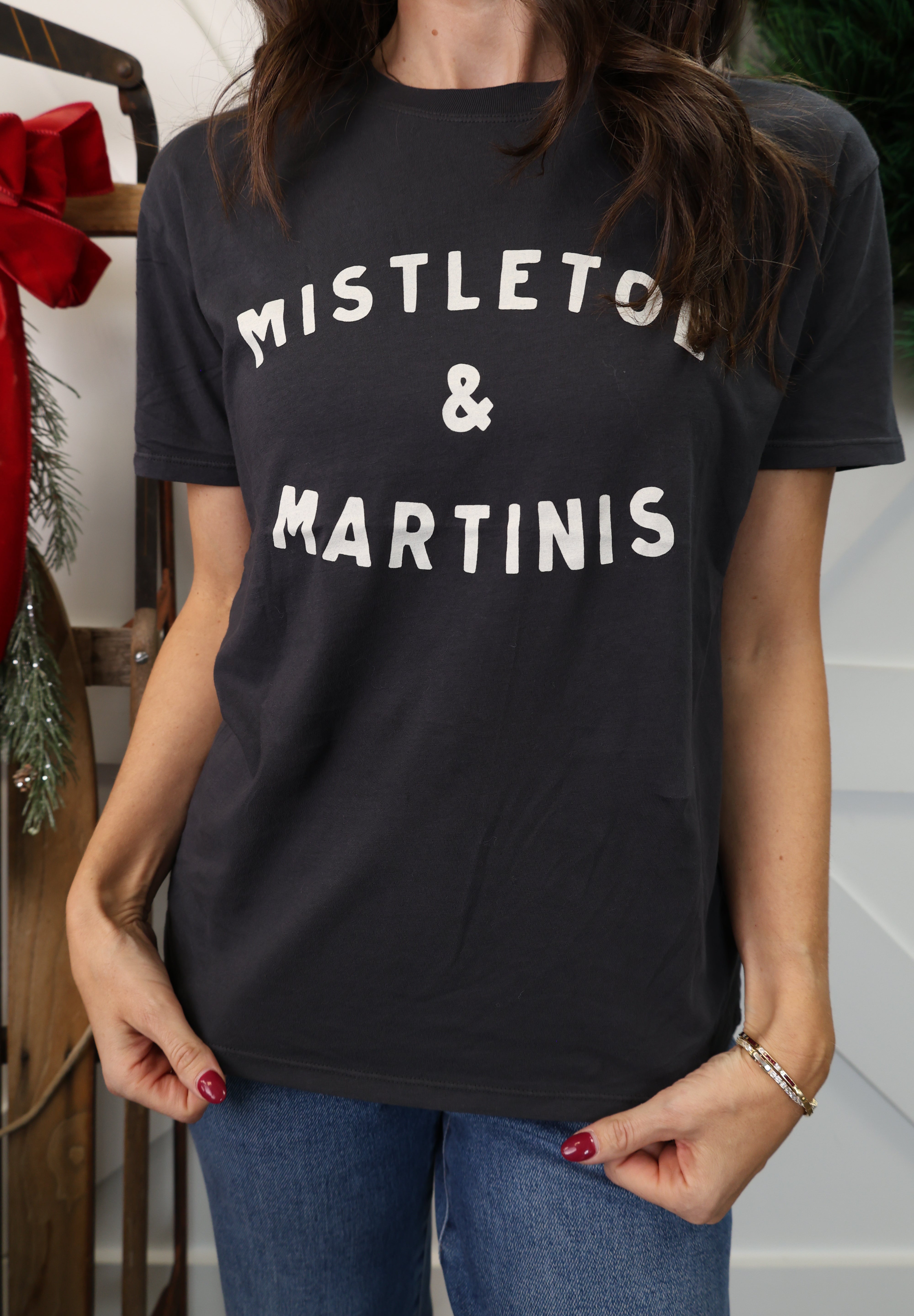 Model wearing Z Supply Mistletoe Boyfriend Tee in black with ‘Mistletoe and Martinis’ front graphic.