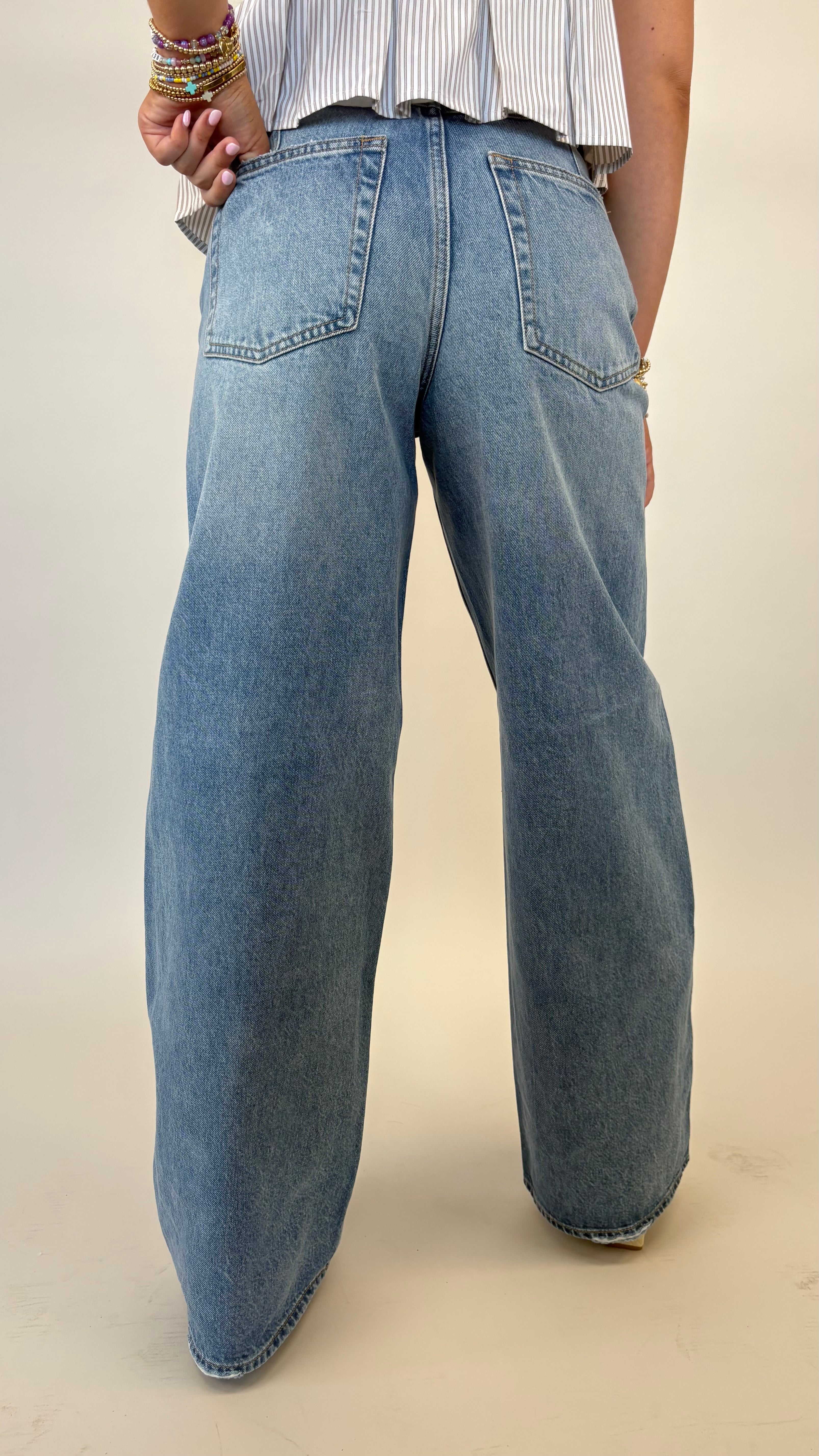 Light wash Pistola Sydney jeans featuring high rise fit and bowed wide leg shape