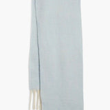 Front view of Free People Winter Chill scarf in blue with textured weave and white fringe detail.