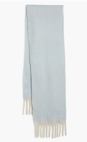 Front view of Free People Winter Chill scarf in blue with textured weave and white fringe detail.