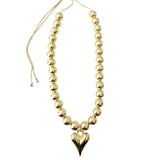 Gemelli Gianna Gold Happy Heart Necklace featuring a small gold heart charm on an adjustable, beaded gold chain.
