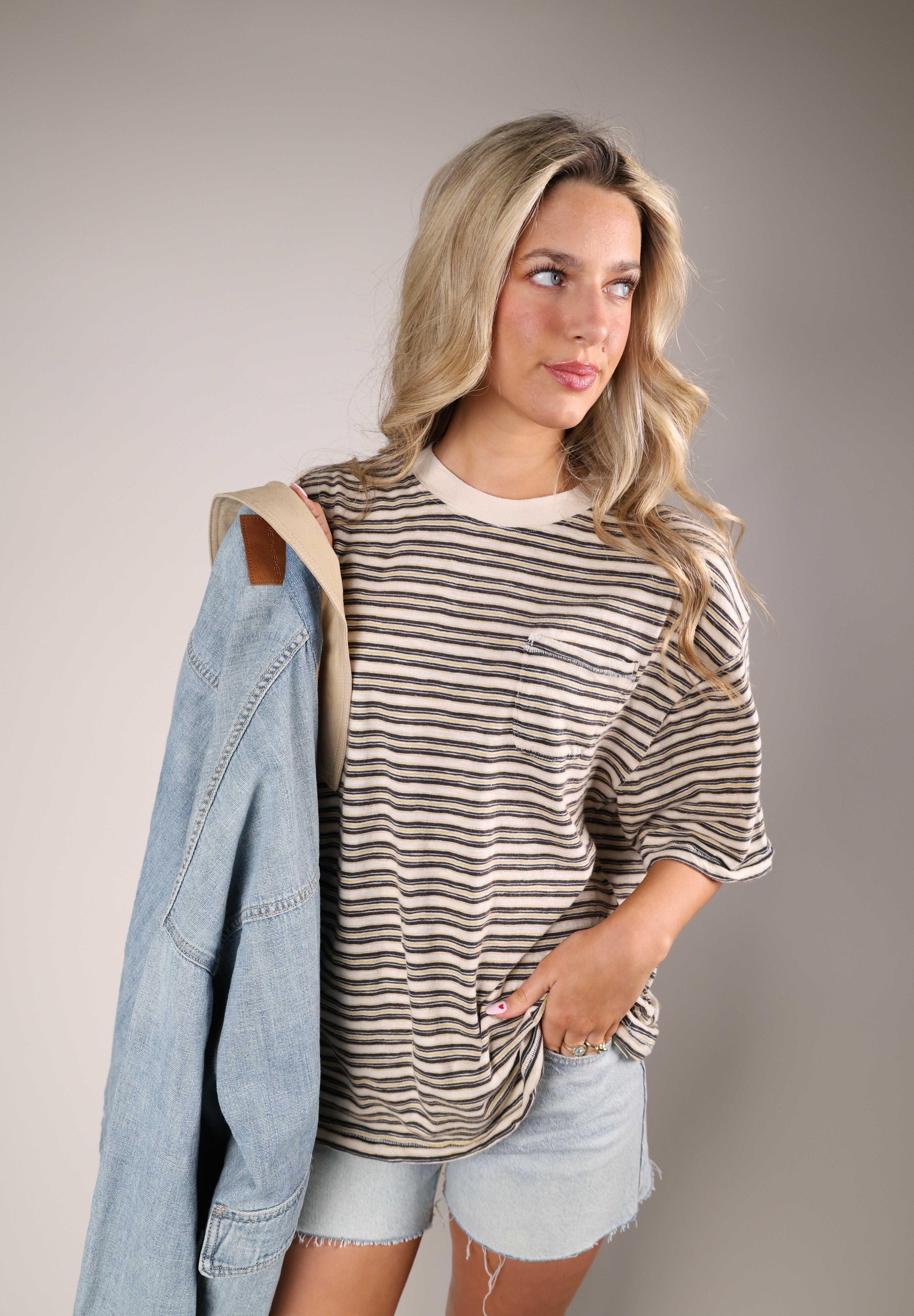 Free People All Love Stripe Pocket Tee in brown and neutral stripes with soft cotton fabric and boxy silhouette.