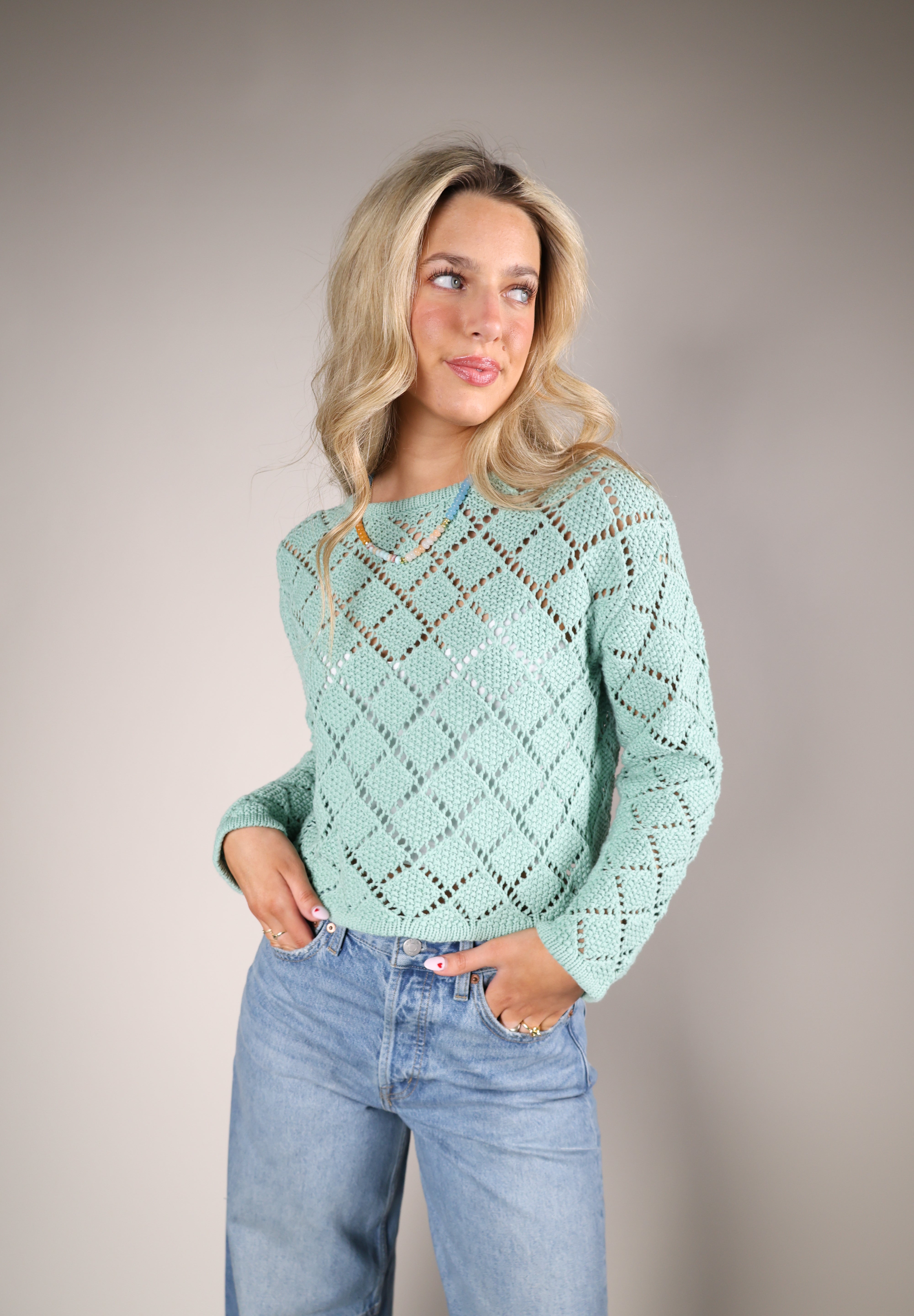 Z Supply Hullen Crochet Sweater in lightweight 100% cotton featuring a diamond crochet pattern and relaxed fit, styled with denim for an effortless transitional outfit.