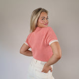Trendy pink Aspen sweater top by Steve Madden with a cropped fit, short sleeves, and a structured Johnny collar.