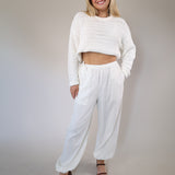 Steve Madden Divinia pants in crisp white linen, designed with a relaxed wide-leg silhouette, side pockets, and a drawstring waist.
