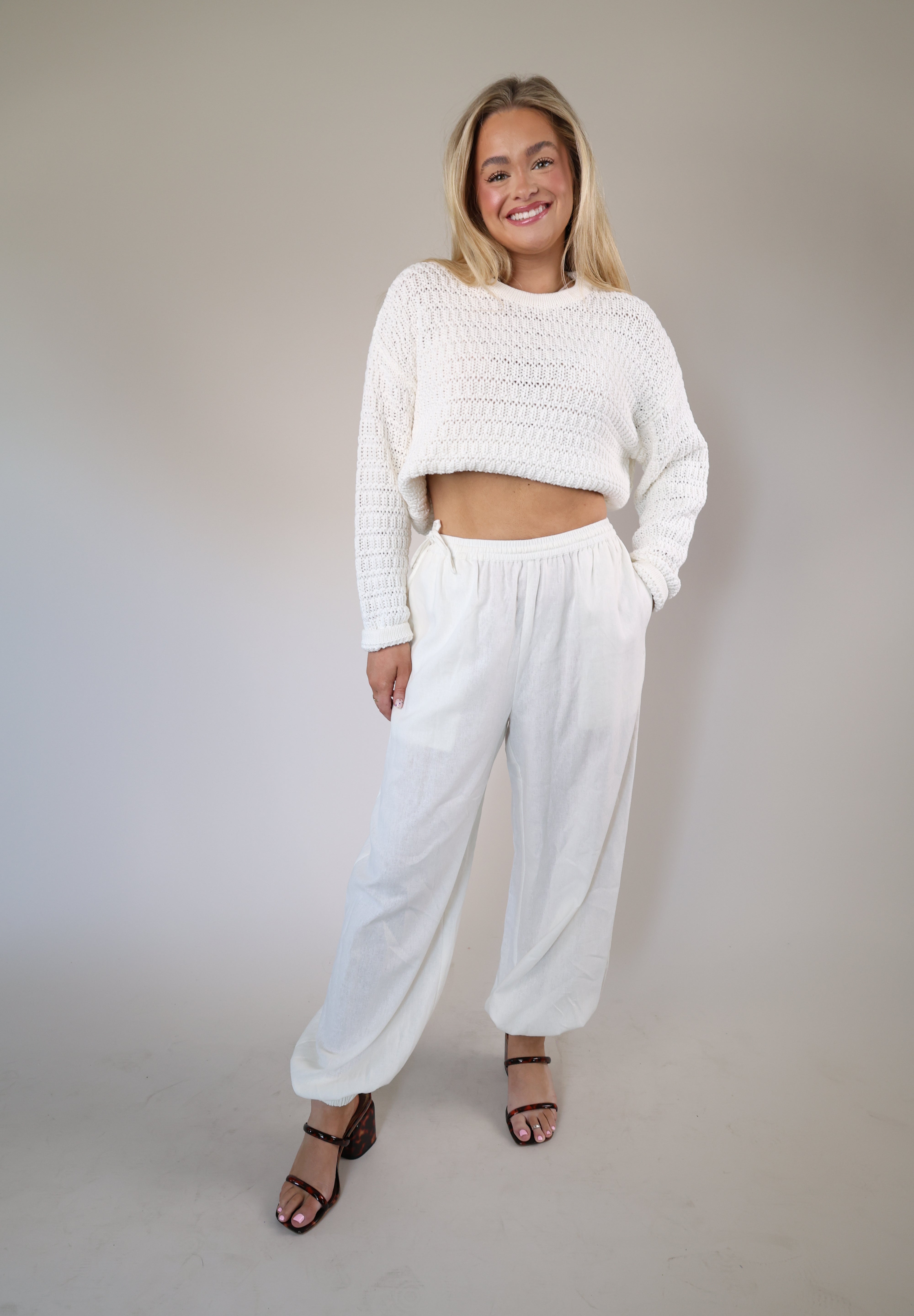 Steve Madden Divinia pants in crisp white linen, designed with a relaxed wide-leg silhouette, side pockets, and a drawstring waist.