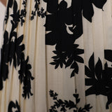 Shear Boutique spring maxi dress ivory floral dress with tiered silhouette and black detail chic spring outfit