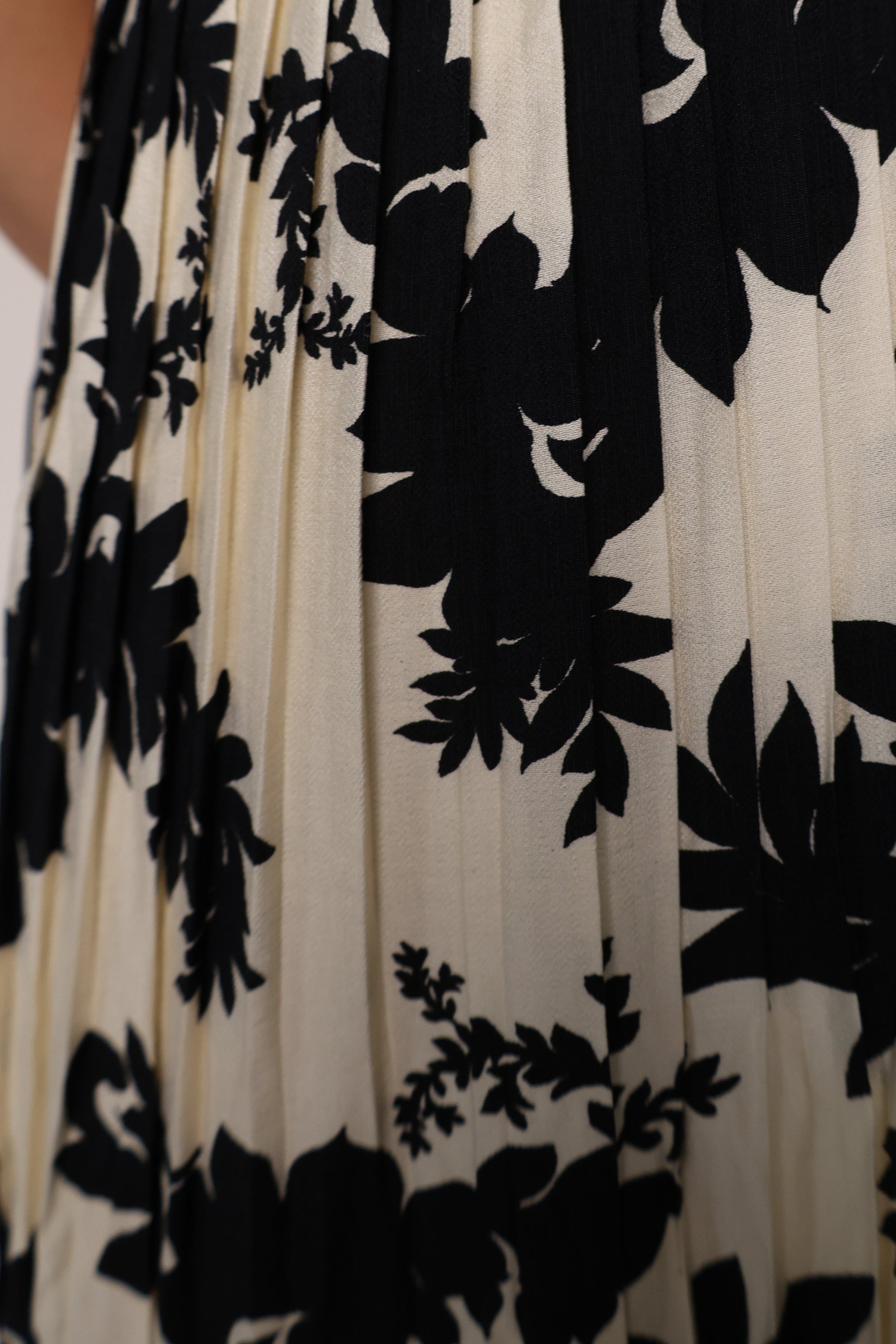 Shear Boutique spring maxi dress ivory floral dress with tiered silhouette and black detail chic spring outfit