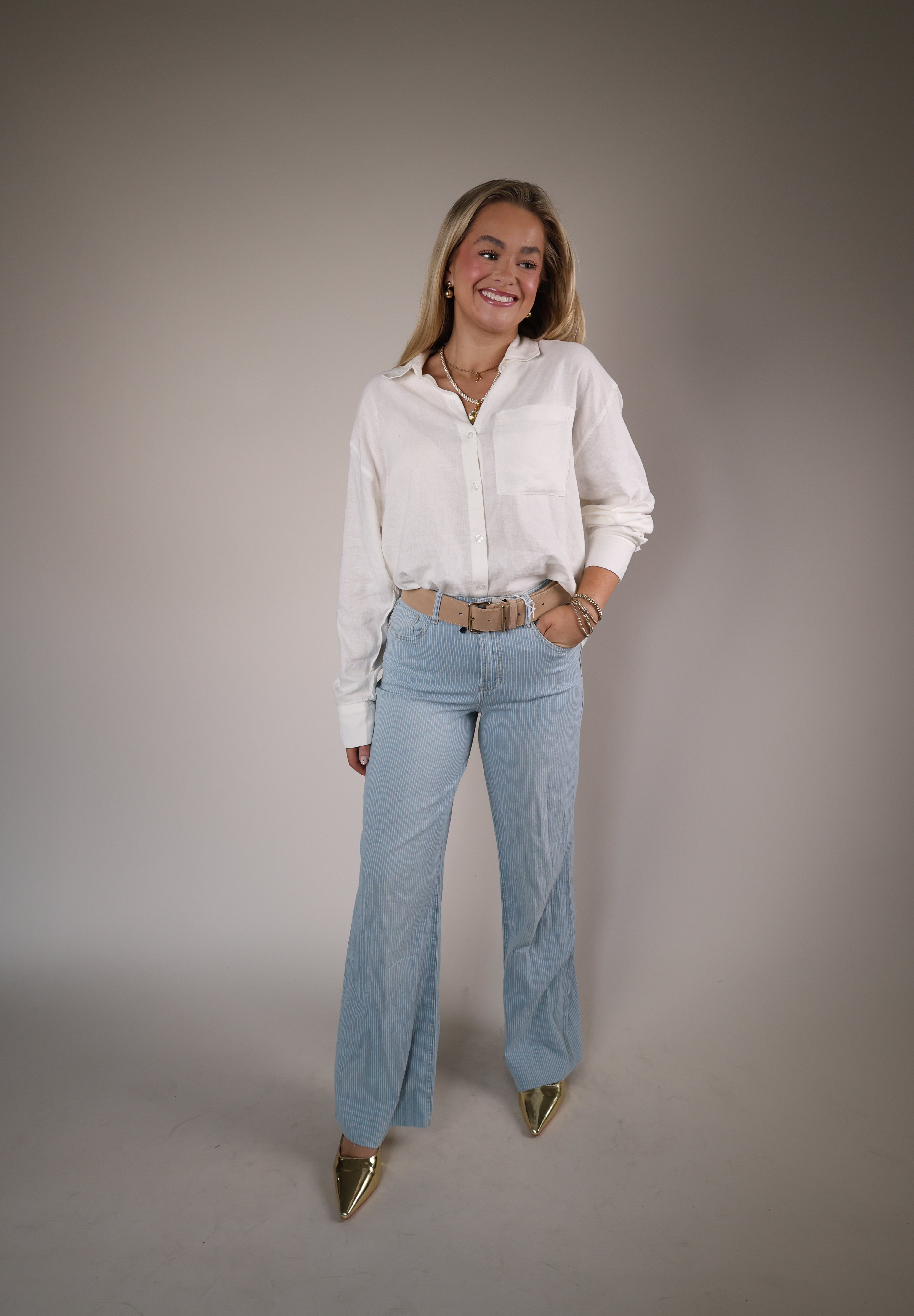 Shear Boutique spring 2026 white blouse relaxed button up shirt versatile layering piece everyday style