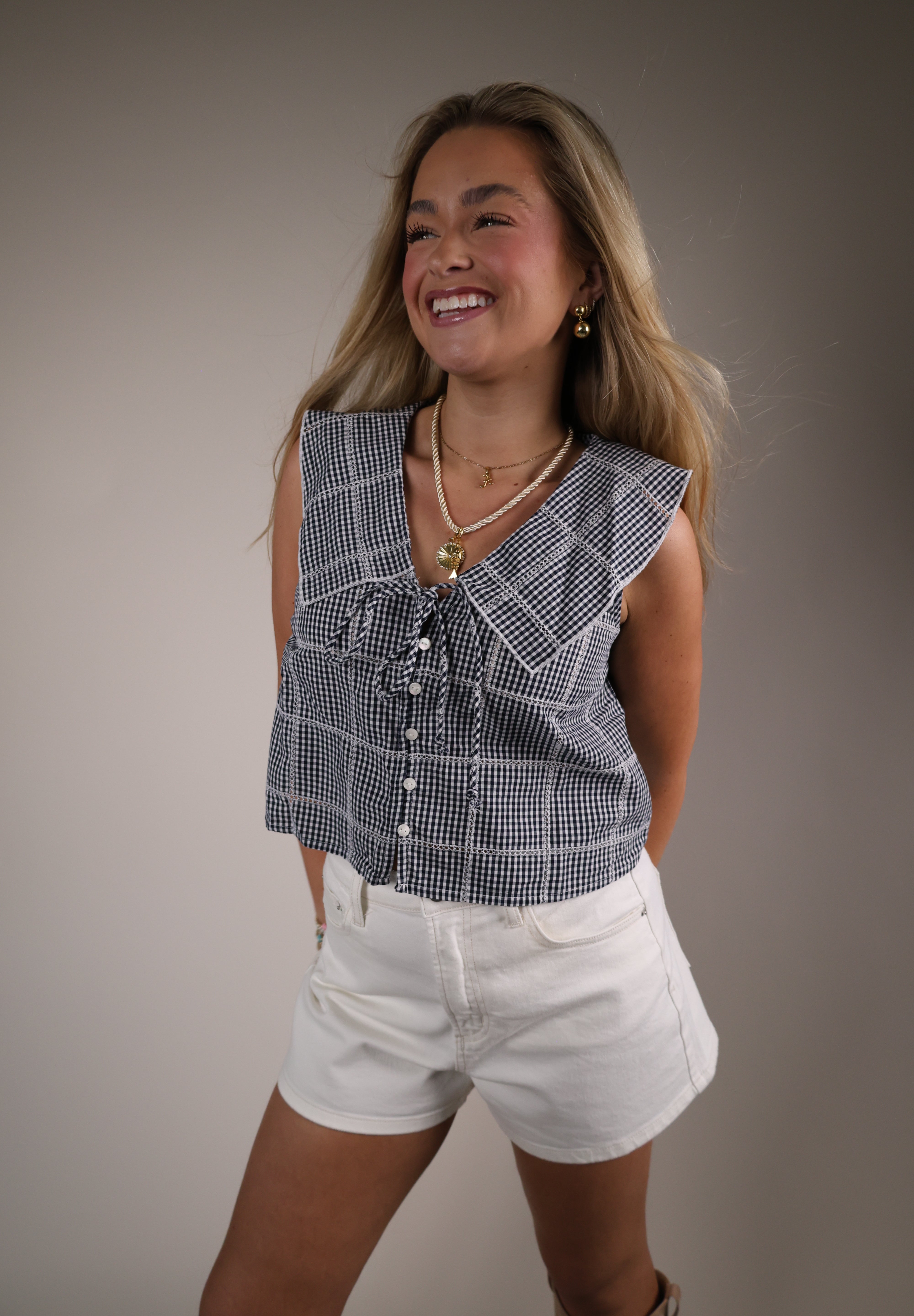 Shear Boutique gingham top spring 2026 navy plaid cropped top with statement collar and front tie detail