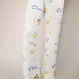 Z Supply Vintage Tropic pants in cream with colorful tropical print and relaxed wide-leg fit.